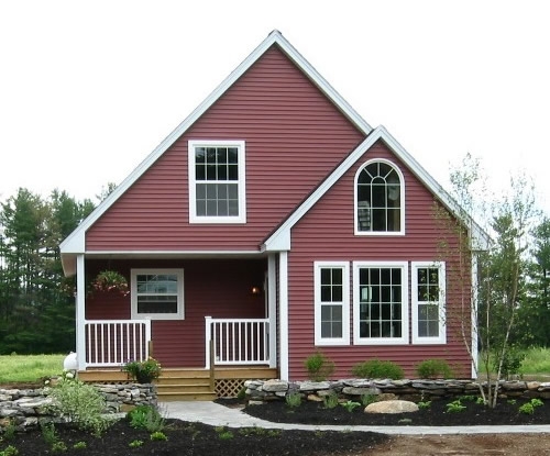Red two story house with peak roof